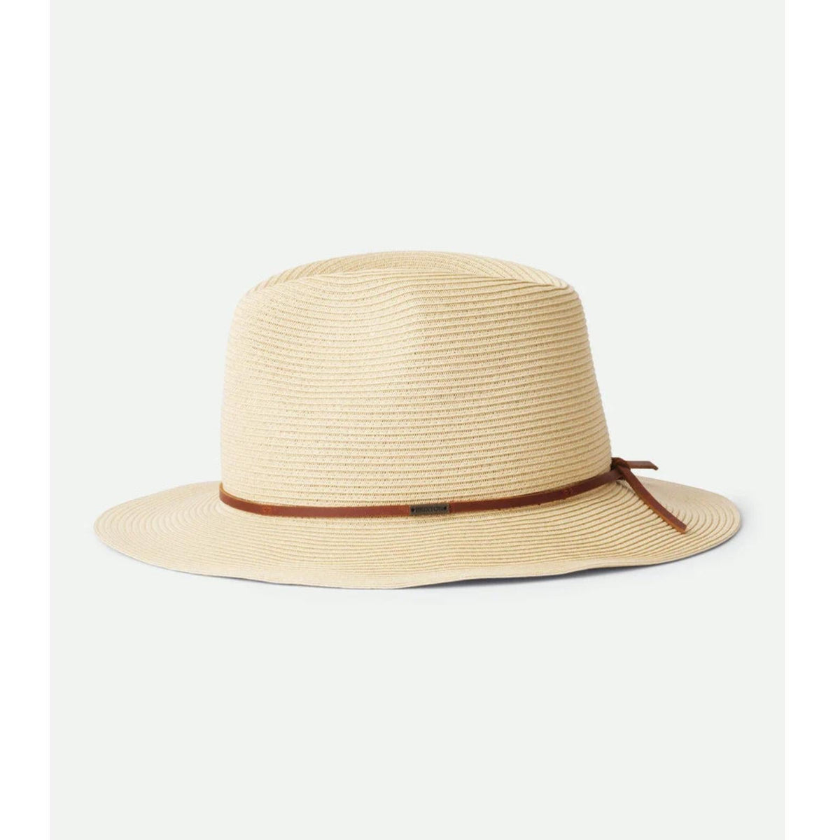 A light beige woven straw fedora hat with a thin brown ribbon band tied in a bow, shown against a plain off-white background.