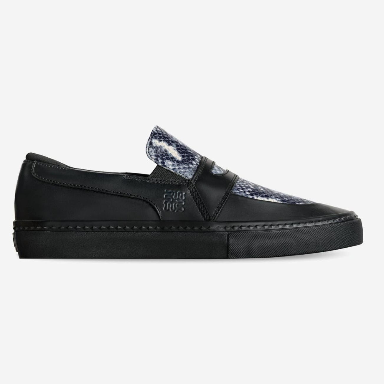 Black slip-on sneaker with snake print tongue on a white background
