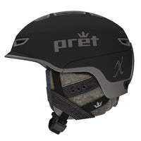 A black Pret W Vision X helmet featuring a visor, adjustable strap, and branding on the side