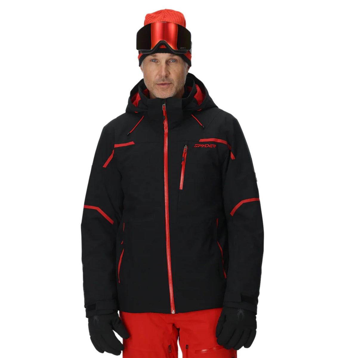 Person wearing a black and red ski jacket with a white background