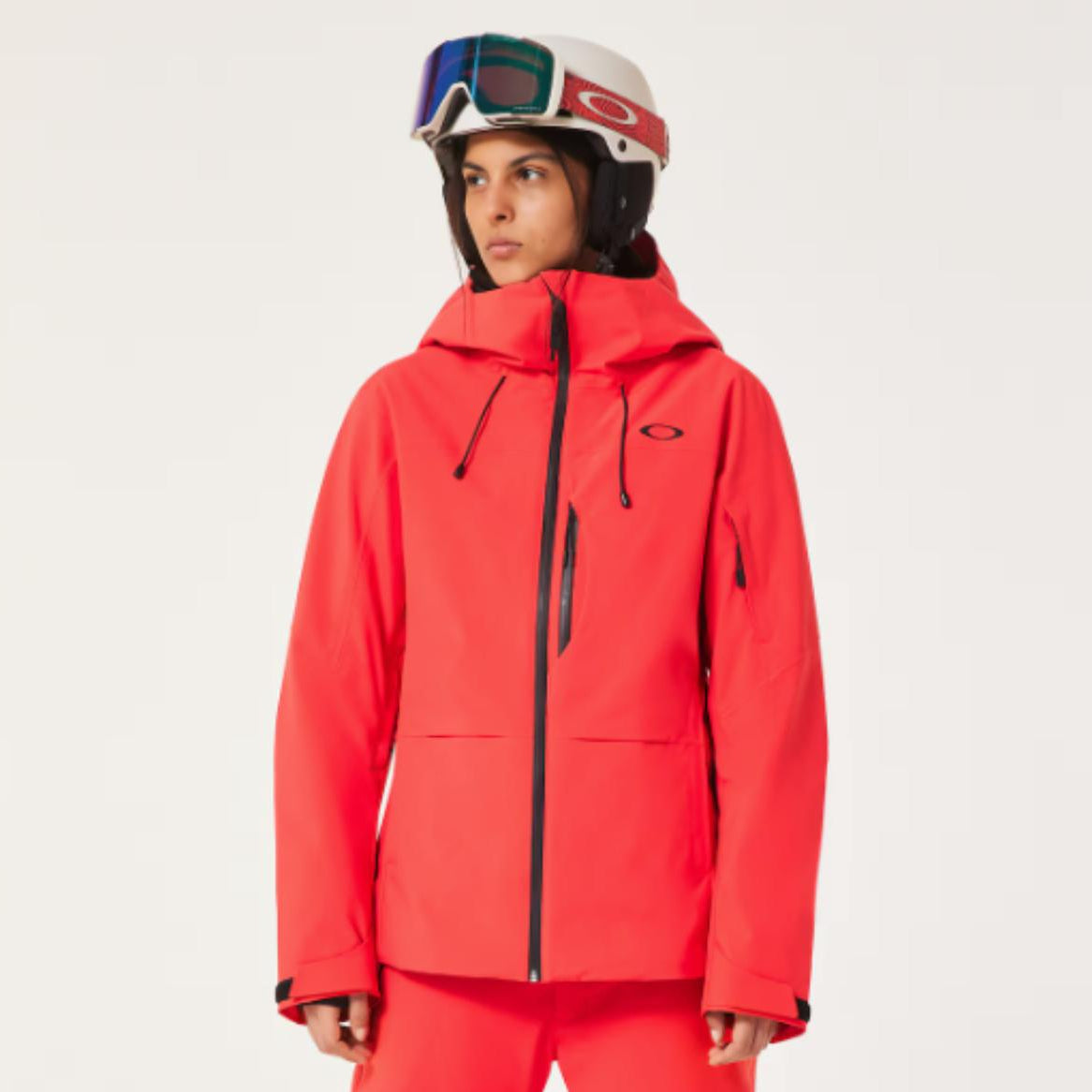 Person wearing a red ski suit with goggles on a white background