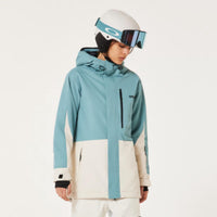 Person wearing a blue and white snow jacket with matching pants on a white background