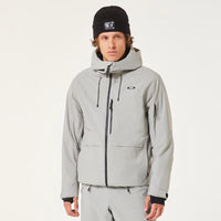 Person wearing a gray snowsuit with black boots on a white background